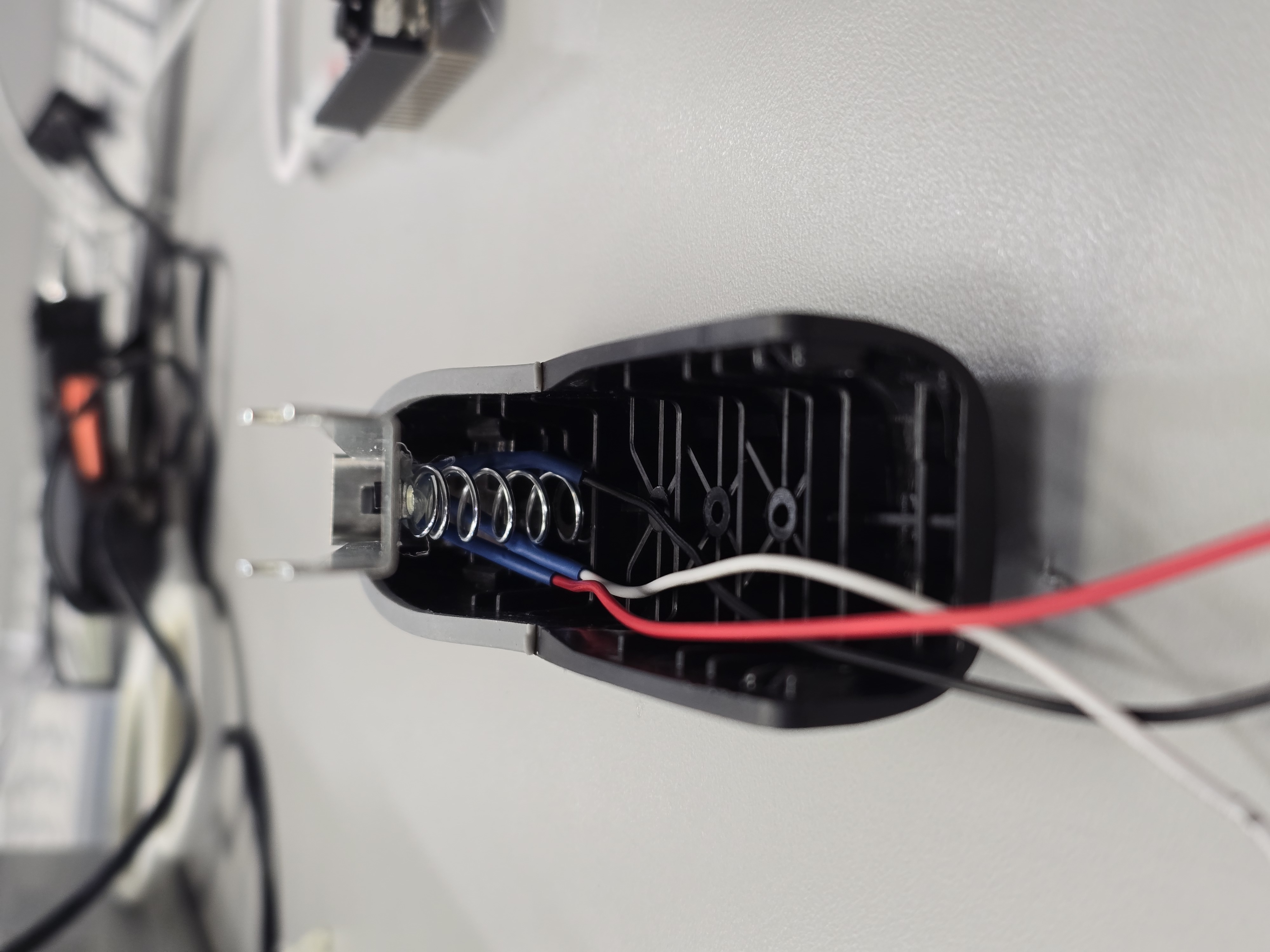 Rear cavity with spring and harness in place