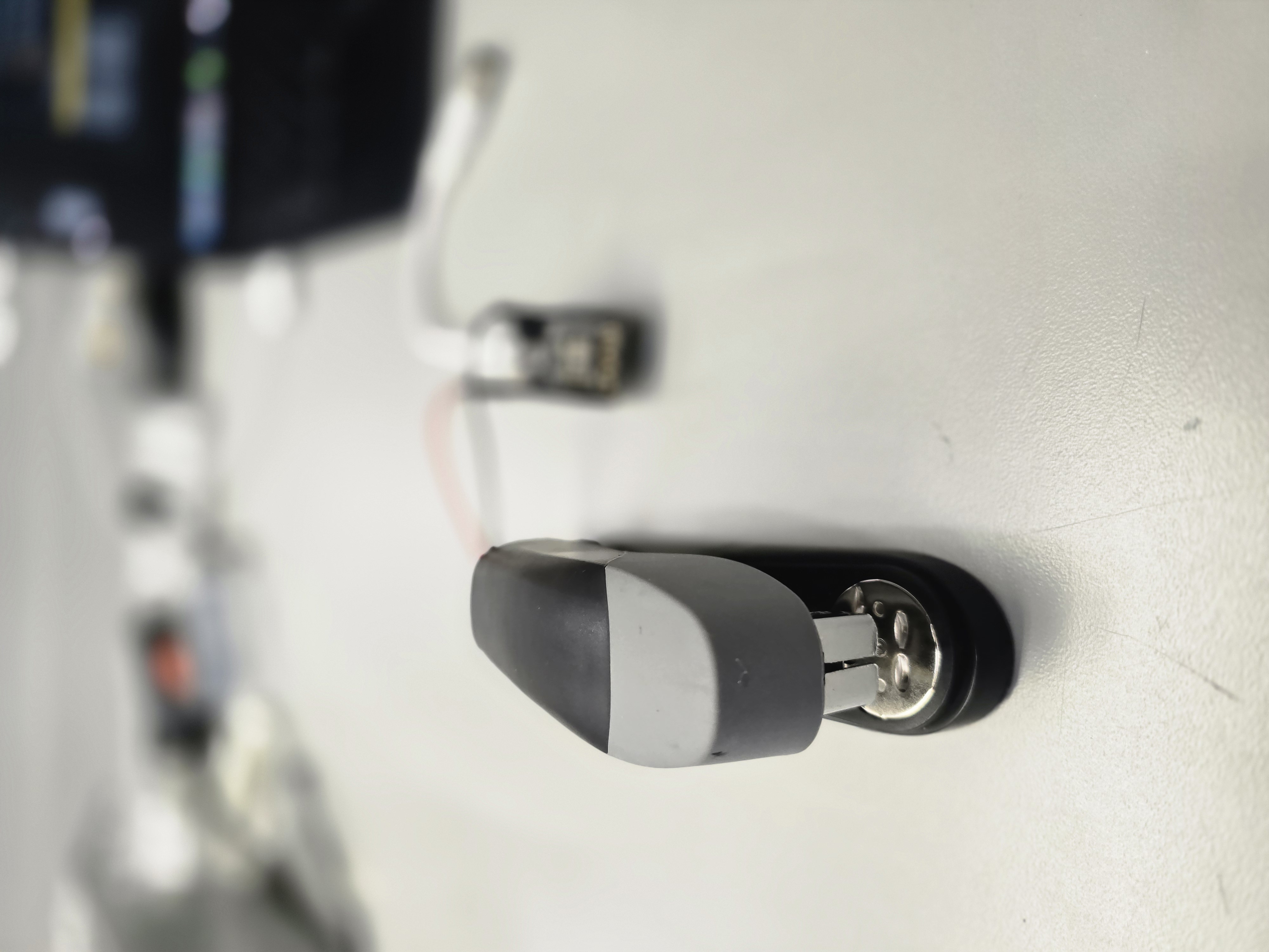 Front view of stapler with controller blurred in background