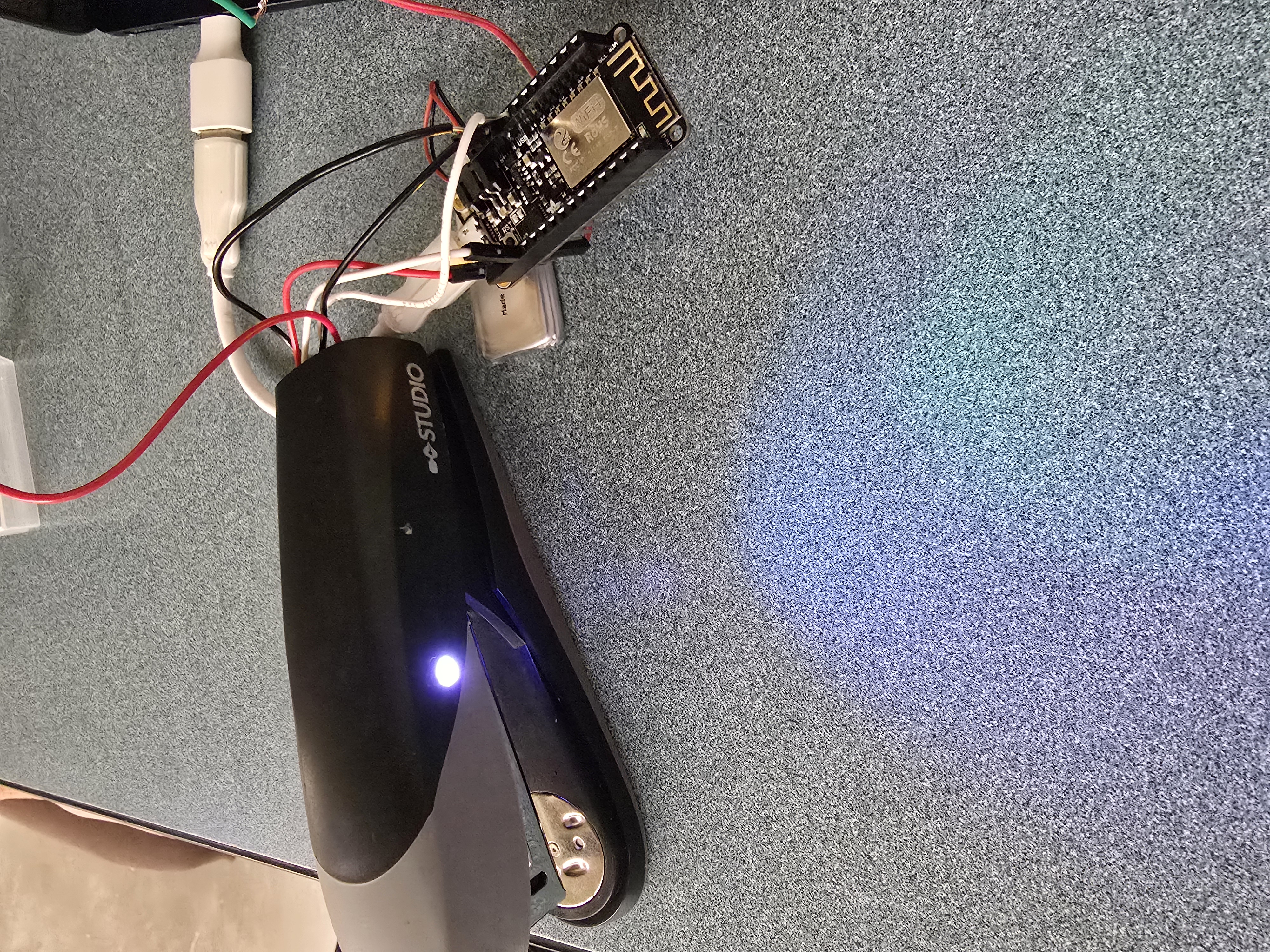 Blue-lit NeoPixel on stapler driven by ESP8266